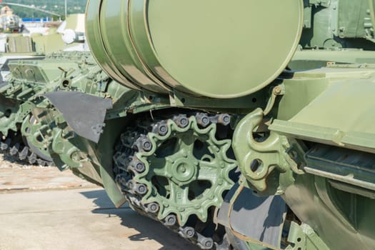 caterpillar track of military armored vehicles close-up. photo