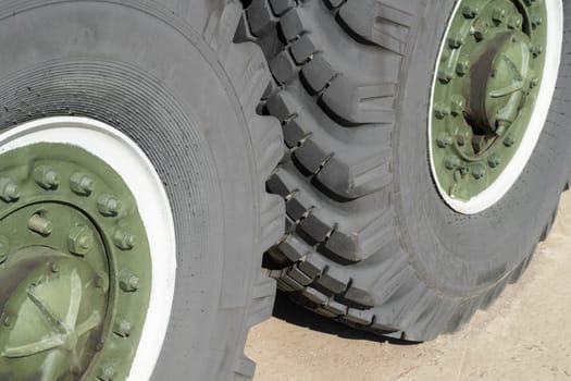 wheels on an armored military vehicle close-up. photo