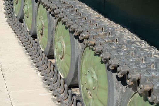 caterpillar track of military armored vehicles close-up. photo