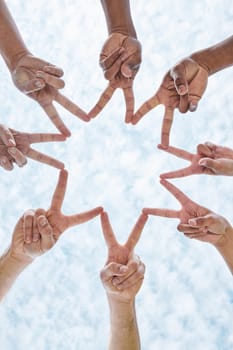 Hands in circle star, blue sky and community in collaboration for global support, trust and diversity. Teamwork, hand and summer sunshine, positive mindset and group of people in solidarity huddle