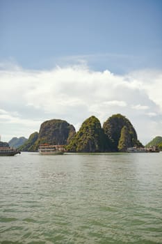 The vast beauty of Vietnam. boats floating down a river in Vietnam
