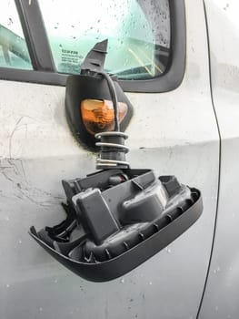 Vandalised car with smashed wing mirror. Insurance. Business.