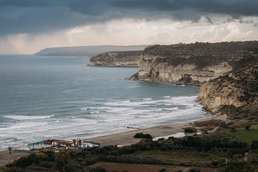 A rocky coastline meets the crashing ocean waves on Cyprus.