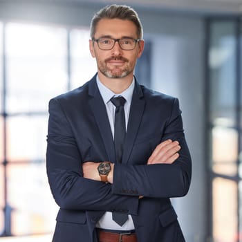 Portrait, business and man with arms crossed, career and startup success with confidence, ceo and employee. Face, mature male person or happy entrepreneur in a suit, professional and boss with skills.