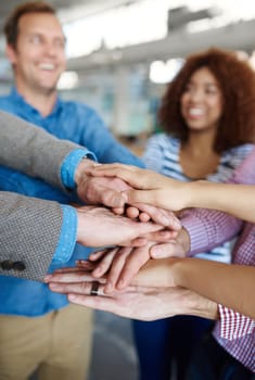 Blur, teamwork or hands of business people in stack for mission goals, collaboration or support. Team building, closeup or happy employees in meeting with smile, solidarity or motivation together.