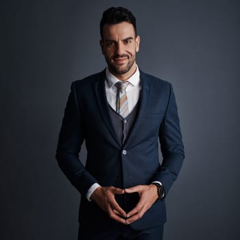 In business, focus is everything. Studio shot of a stylish and confident young businessman posing against a gray background