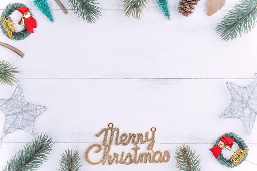 Christmas concept composition decoration objects, fir tree branch wreath and ornament isolated on white wooden table, top view, flat lay, layout up.