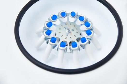 Blood test tubes in centrifuge. Plasma preparation in medical.