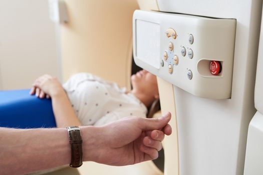 Female patient undergoing MRI - Magnetic resonance imaging in a Hospital. Medical Equipment and Health Care