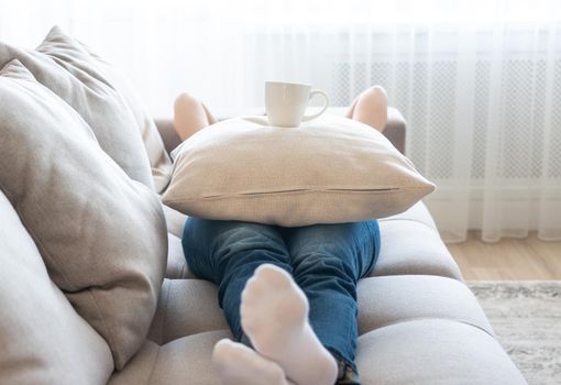 Young woman relaxing on her couch
