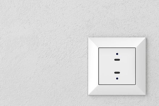 Wall socket with two USB-C ports for charging various types of electronic devices