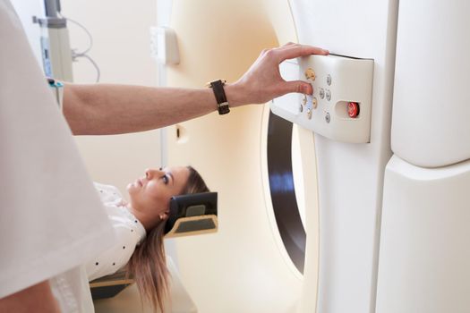 Female patient undergoing MRI - Magnetic resonance imaging in a Hospital. Medical Equipment and Health Care