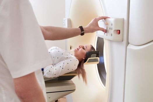 Female patient undergoing MRI - Magnetic resonance imaging in a Hospital. Medical Equipment and Health Care
