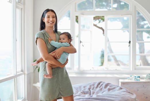 Portrait, happy mother and holding baby in home for love, care or quality time together for childcare development. Mom carrying infant kid, newborn girl and smile in support, comfort and nursery room.