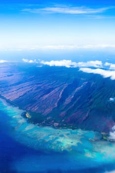 Mountainous Western corner of island of Maui seen from plane