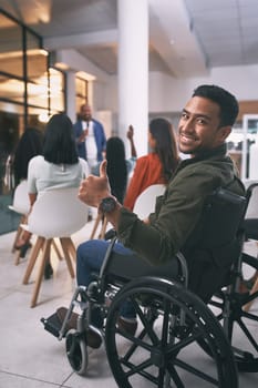 This has been informative to him. a young businessman showing a thumbs up during a conference at work