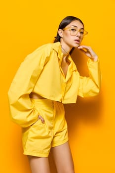 woman fashion joy attractive lifestyle positive young background happy glasses yellow girl lady hair glamour smile female romance trendy long dance beautiful