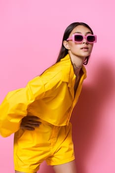 female woman brunette glamour sunglasses fun attractive lifestyle model girl trendy young beauty beautiful style smile fashion yellow outfit stylish emotion