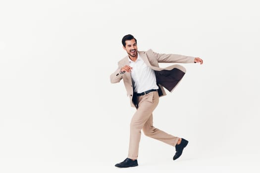 occupation man white young fashion shirt running arm male standing professional winner beige jumping suit businessman business smiling victory studio happy