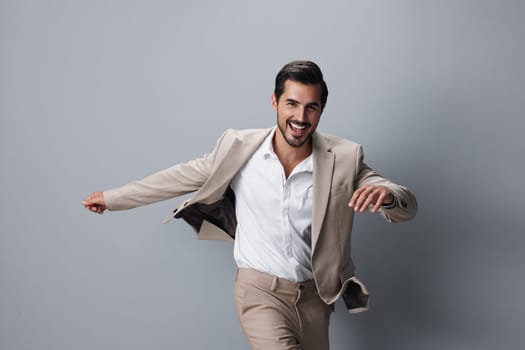 businessman man success professional confident background business beige smile happy portrait arm up winner white running victory hand shirt suit sexy