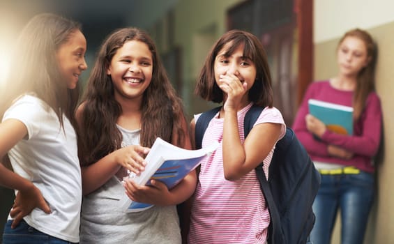 Girl, school and bullying angry kid is sad by problem with students at school building. Young, teenager and notebook gossip about kid on wall studying in class for an education is depressed