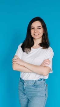 Successful Businesswoman in Casual Attire - Confident Female Office Manager with Crossed Arms - Isolated on Blue Background - Ideal for Corporate, Career, and Professional Concepts.