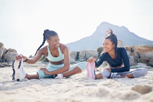 Stretching, running and friends with women at beach for fitness, yoga and workout. Relax, health and wellness with female runner and warm up in nature for training, teamwork and cardio performance.
