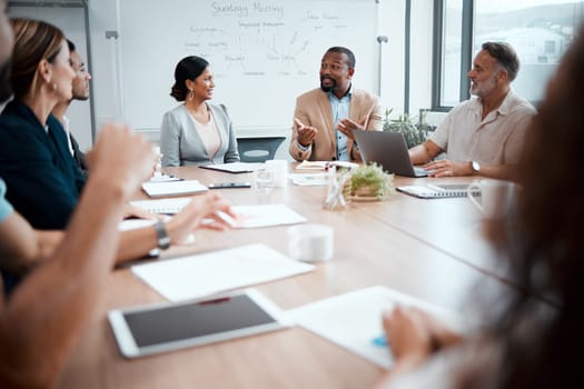 Business people, corporate and meeting in planning for strategy, brainstorming or sharing ideas at office. Group of employees in team discussion, collaboration or plan in conference at the workplace.