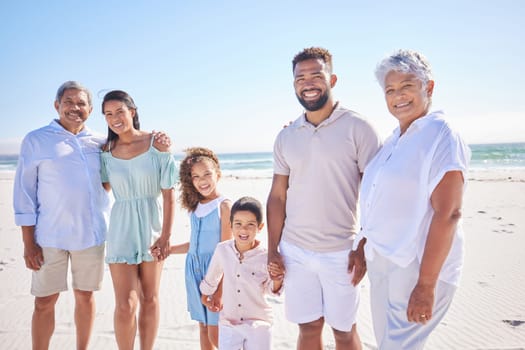 Happy family, grandparents portrait or children at sea holding hands to relax on holiday together. Dad, mom or kids siblings love bonding or smiling with grandmother or grandfather on beach sand.