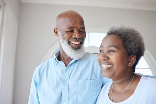 Senior black couple, smile and together in a happy home with love, care and commitment. Face of an african woman and man thinking about marriage, retirement lifestyle and happiness with a hug.