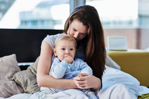 Mother, baby and sad with depression at family home due to mental health and is frustrated. Child, mom and postpartum with worry and anxiety at home with insomnia has love for children development
