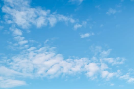 Background of blue sky with white clouds. Natural backdrop