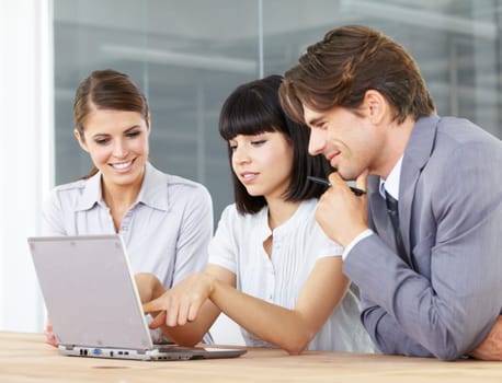 Business people, laptop and meeting in teamwork, collaboration or planning for marketing strategy at the office. Businessman and women working on computer for ideas or project plan at the workplace.