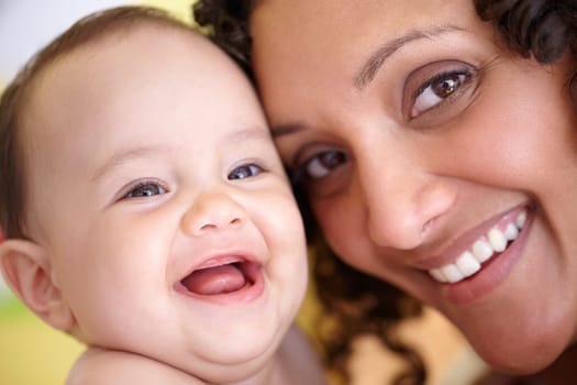 Mother, baby and closeup portrait of happy faces of Arabic family or picture of mom, laughing kid and fun memory together. Face, healthy child and mommy smile of happiness in home, house or bedroom.