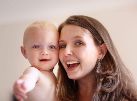 Mother, baby and closeup portrait of happy faces of young family or picture of mom, excited kid and fun memory together. Face, healthy child and mommy smile of happiness in home, house or bedroom.