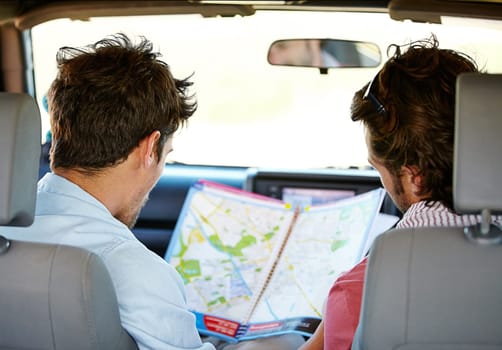Road trip, map and people for travel adventure, journey and holiday with tourism guide, check and planning. Driver, men or young friends with location search, direction and destination from behind.