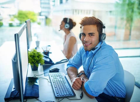 Happy businessman, portrait and call center for customer service, support or telemarketing at office. Friendly man person, consultant or agent with smile on computer for online advice in contact us.