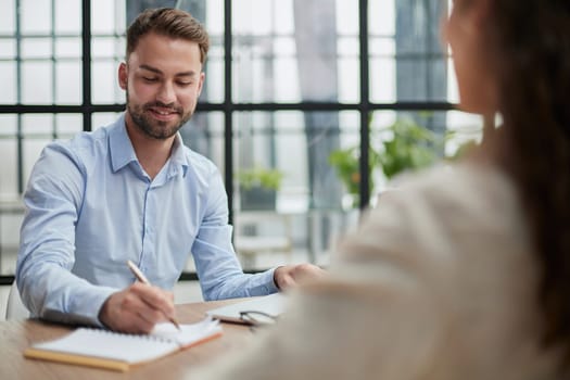 Handsome bearded man in a modern office