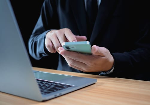 Businessman using phone and computer for work. Business concept. communication concept