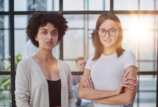 Businesswomen Having Informal Meeting In Modern Office