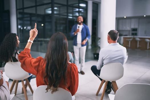 He can provide any clarity you need. an unrecognizable businessperson raising their hand to ask a question during a conference at work