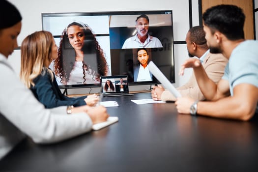 Video call, meeting and strategy with a business team in the boardroom for a virtual conference or workshop. Management, webinar and planning with a group of corporate colleagues in an office at work.