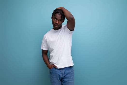 stylish young man with dreadlocks in a white t-shirt with empty space for logo.