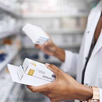 We have just what the doctor prescribed. a pharmacist filling a prescription at a chemist