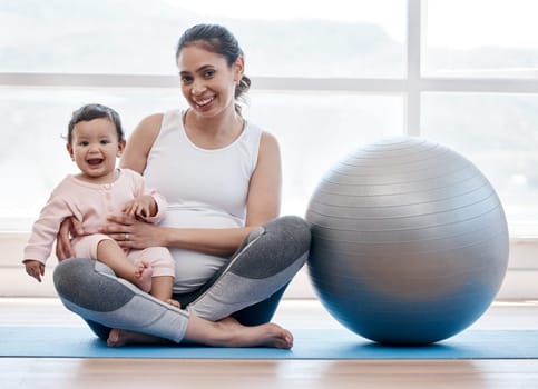 Mom, baby and floor in portrait by exercise ball, laughing and bonding together for fitness, health and wellness. Workout, pregnant mother and newborn with happiness, home and excited face for yoga.