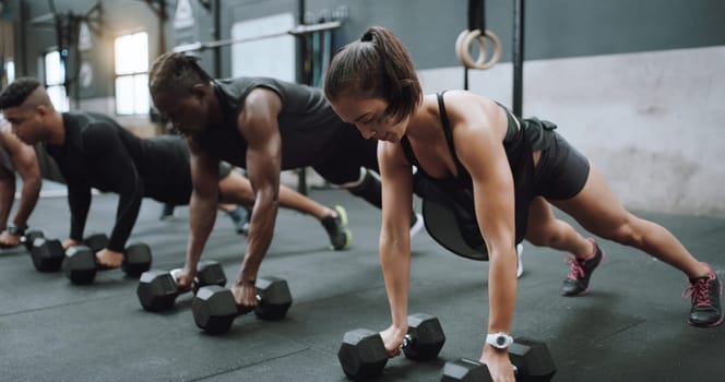 Gym class, weights and plank workout with training and exercise group with strength. Diversity, people and strong challenge for body lifting and fitness of athlete friends with dumbbell for health.