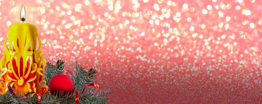 Bright yellow carved candle on a shiny gold background. Background for a Christmas card. Valentine's day. Background for advertising and business. Panorama Of The Banner. Christmas, New year, Valentine's Day