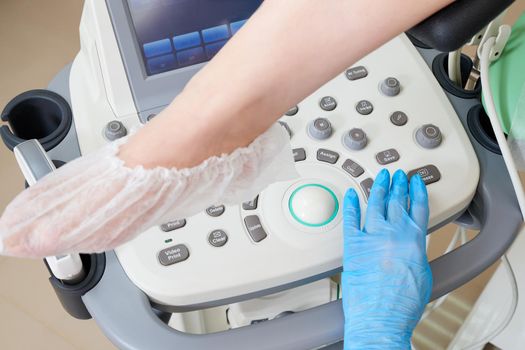 Cropped view of gynecologist and patient doing an ultrasound scan