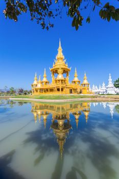 Gold pagoda in Wat Rong Khun or White Temple, Landmark, Chiang Rai, Thailand.