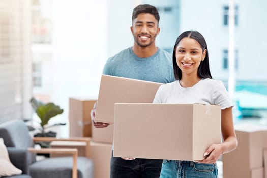 Box, happy and portrait of couple in new home excited for property, apartment and real estate investment. Relationship, moving day and man and woman carrying boxes for relocation, move and house.